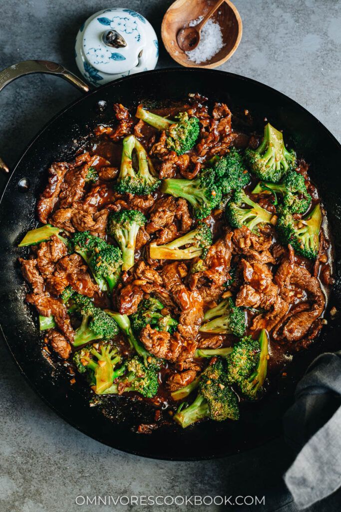 beef and broccoli stir frying in a skillet