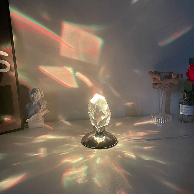 the light is shining through the glass on the table