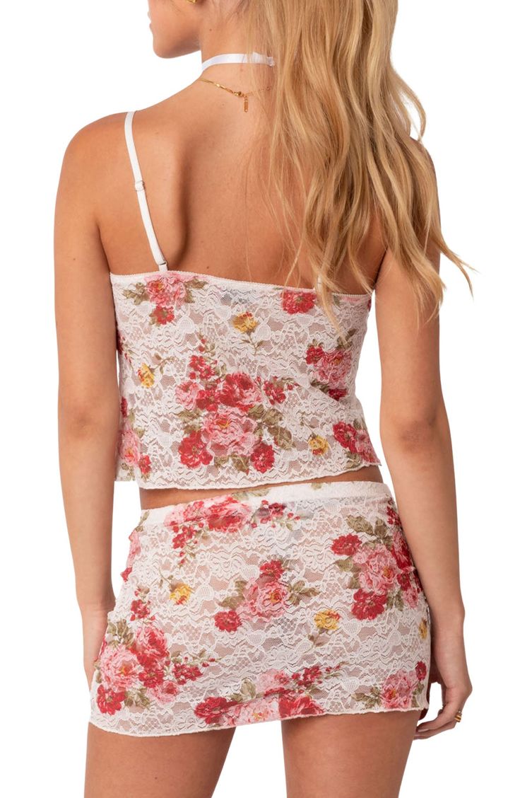 A romantic floral print adorns this sheer lace camisole crafted with a tie at the bust that highlights a delicate keyhole cutout. V-neck Adjustable straps 95% polyester, 5% spandex Hand wash, dry flat Imported Spring Fitted Delicate Lace Camisole, Fitted Delicate Lace Camisole For Spring, Feminine Lace Camisole With Lace Top, Feminine Lace Tank Top With Delicate Detail, Lace Daywear Camisole, Lace Patchwork Camisole, Feminine Lace Top With Delicate Straps, Fitted Floral Print Camisole, Feminine Delicate Lace Tank Top