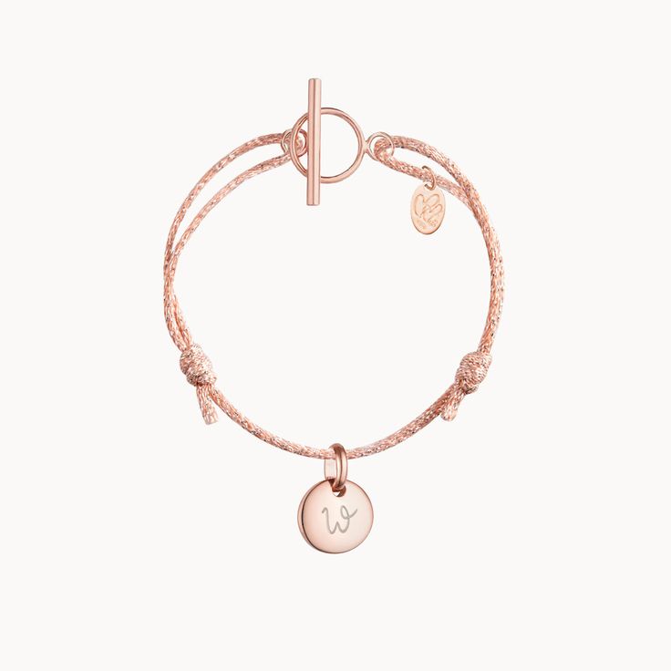 A meaningful gift with colorful sparkle, our Personalized Sparkling Mini Charm Bracelet can be personalized to perfectly capture a special personality. Each braid adds a pop of colour and sparkle to every movement, perfectly matching your metal of choice. Engrave up to three mini charms to treasure with the names of loved ones and little to make your unique keepsake extra-special.&nbsp;18K Champagne Gold Plated, 925 Sterling Silver or 18K Rose Gold PlatedCharms: 0.4x0.4 (mini heart, disc or Adjustable Jewelry With Logo Charm As Gift, Rose Gold Friendship Bracelets With Charms, Mini Charm, Sliding Knot, Mini Heart, Champagne Gold, Hand Engraving, Meaningful Gifts, 18k Rose Gold