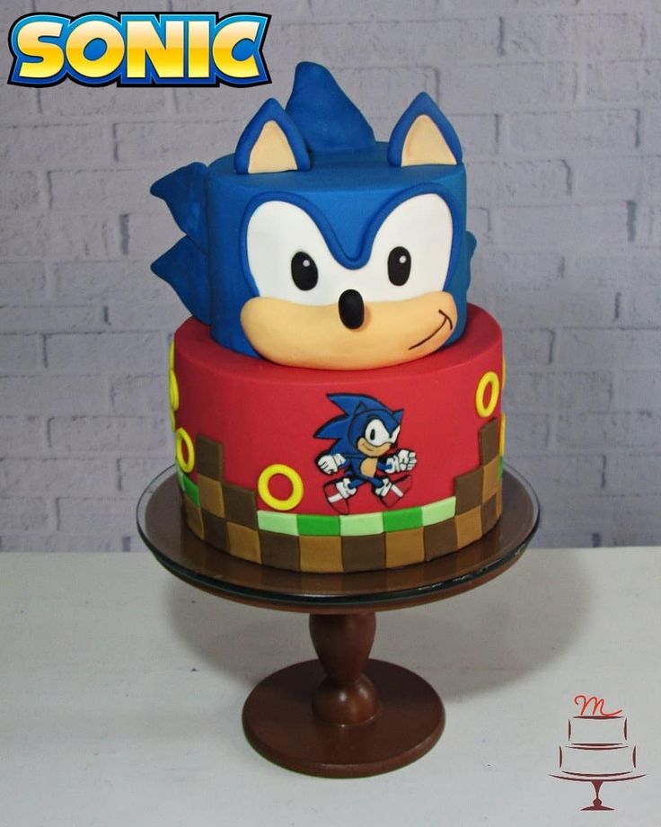 sonic the hedgehog cake on top of a wooden stand