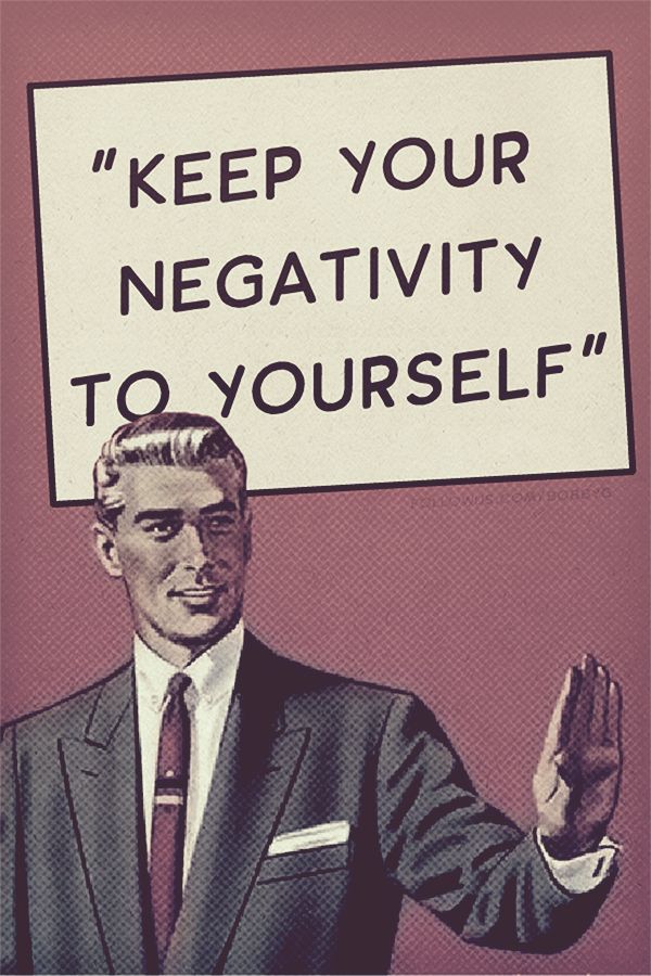 a man in a suit and tie holding up a sign that says keep your negativeity to yourself