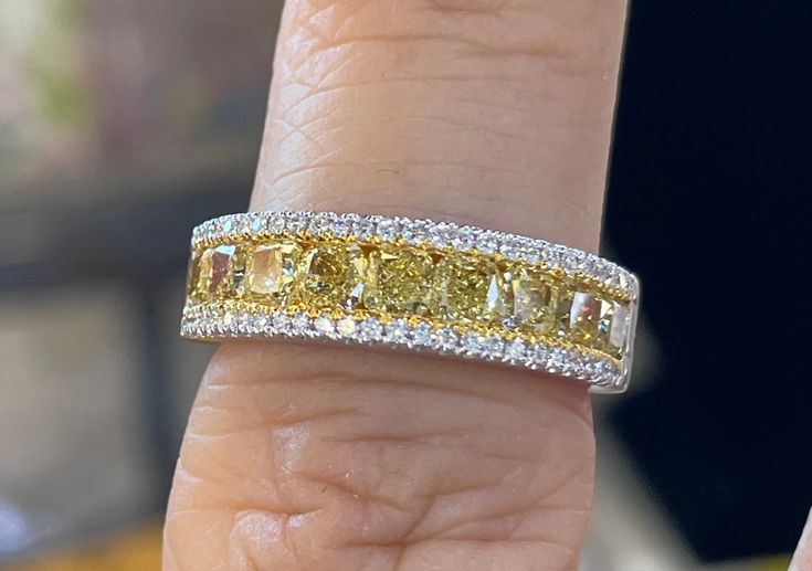 Fancy Yellow Diamond Band is the perfect gift for someone who has it all.  It's very different looking and simple and classy.  All the diamonds are shiny and sparkles a lot.  The diamonds are all set smooth, so won't catch on things.  If you like the look of two-tone this band is perfect for you also.  The Center yellow diamonds is flanked on each side by 1 row of small white diamonds.  The band measures about 5.1mm width and tapers about 3.3mm at the bottom of the band.   The band is solid insi Fancy Yellow Diamond Ring, Ring Upgrade, Yellow Diamond Ring, Stackable Diamond Rings, Yellow Diamonds, Yellow Diamond Rings, Fancy Yellow Diamond, Stackable Bands, Chinese Recipes