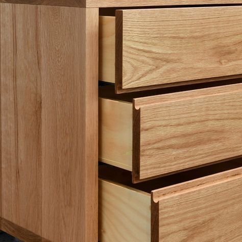 a close up of a wooden drawer with drawers in it's center and bottom