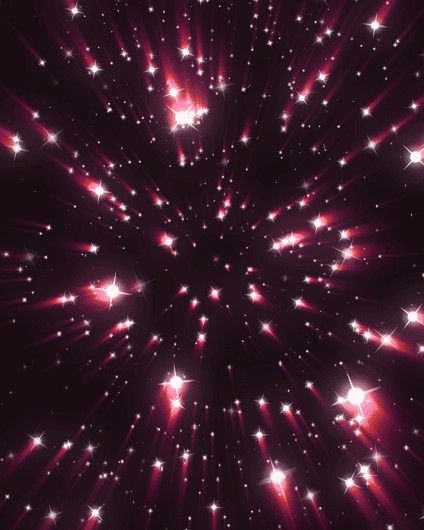 fireworks in the night sky with red and white stars coming out from it's center