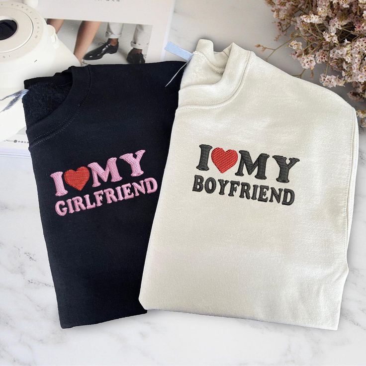 Let the world know how much you adore your special someone with these fun and cute embroidered hoodies and T-shirts! 💕 Whether you’re cozying up in a hoodie or stepping out in a T-shirt, these matching sets are the perfect way to show off your love. 💖👫#toscustom #toscustomhoodie #toscustomtshirts #couplegoals #ilovemyboyfriend #ilovemygirlfriend #matchingoutfits #embroiderylove #relationshipgoals 💖👫✨ His And Hers Hoodies, Couple Sweatshirts, Couples Sweatshirts, I Love My Girlfriend, Matching Couple, Embroidered Tee, Personalized Valentines, Personalized Couple, Embroidered Hoodie