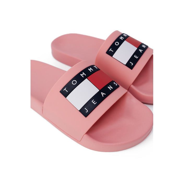 Brand: Tommy Hilfiger Jeans Gender: Women Type: Slippers Season: Spring/Summer PRODUCT DETAIL • Color: pink • Pattern: print • Fastening: slip on • Sole: rubber • Size (cm): 2 COMPOSITION AND MATERIAL • Composition: -100% polyurethane Pink Summer Slip-on Slides, Comfortable Pink Open Toe Slides, Pink Non-slip Slides For Spring, Pink Slide Flip Flops For Summer, Trendy Pink Flip Flops For Summer, Pink Open Toe Slides For Summer, Trendy Pink Slide Sandals, Casual Pink Slides For Vacation, Pink Casual Slip-on Flip Flops