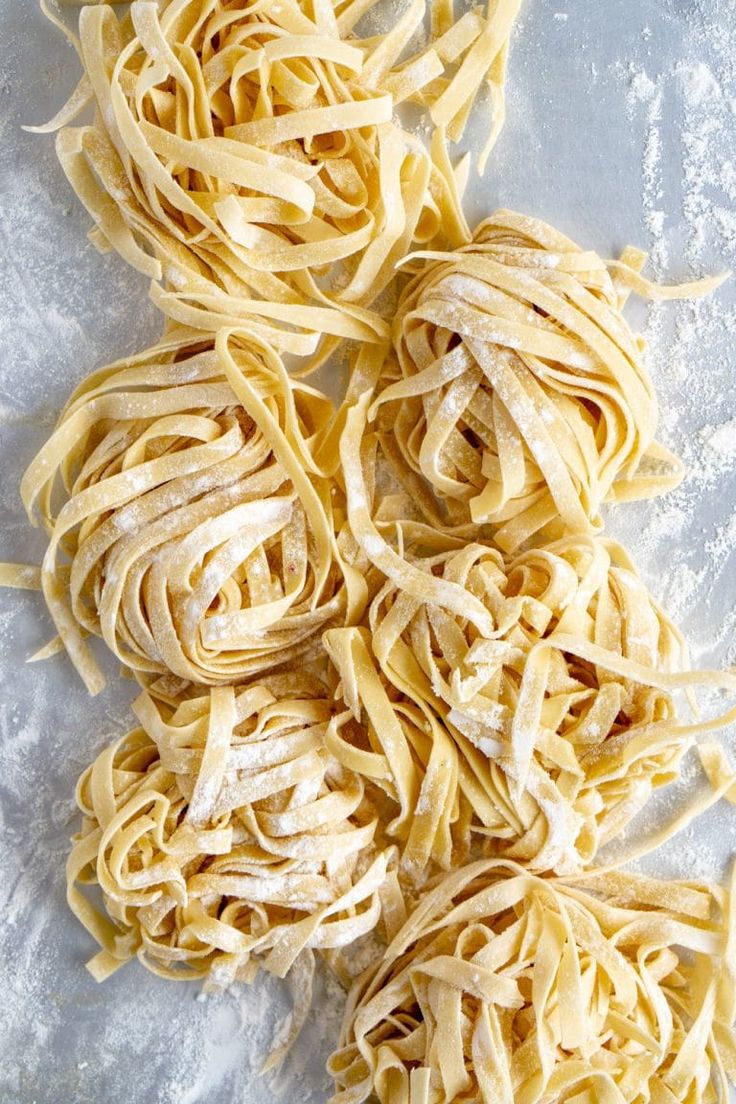 several pieces of uncooked pasta on a white surface