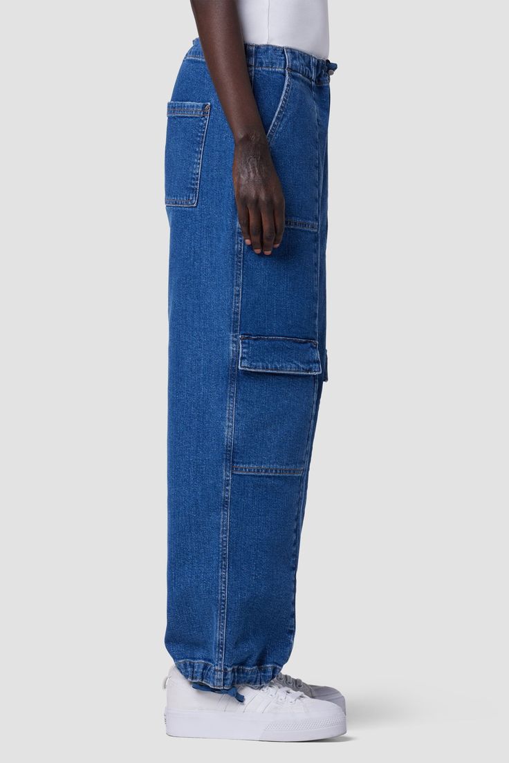 Description The Drawstring Cargo Parachute Pant is a nod to Y2K revival with drawstring detailing at waist and hem, an ideal ankle length and cargo pockets. Cut from premium stretch denim in medium indigo Chill wash. Product Details Front Rise: 11", Leg Opening: 20.75", Inseam: 28"Model Height 5'9"Model wearing size 25Measurements based on size 27 Fit & Care Content: 99% Cotton, 1% SpandexMachine wash cold with like colorsDo not bleachTumble dry low or hang to dry Medium Wash Recycled Denim Cargo Jeans With Five Pockets, Utility Jeans With Patch Pockets In Medium Wash, Utility Style Medium Wash Jeans With Patch Pockets, Washed Blue Utility Jeans With Hip Pockets, Dark Wash Straight Leg Cargo Jeans With Patch Pockets, Utility Washed Blue Cargo Jeans With Five Pockets, High Rise Washed Blue Cargo Jeans With Patch Pockets, Utility Cargo Jeans With Patch Pockets In Medium Wash, Utility Style Medium Wash Cargo Jeans With Five Pockets