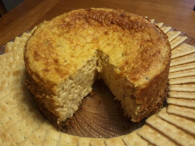 there is a cake that has been cut in half on a plate with crackers