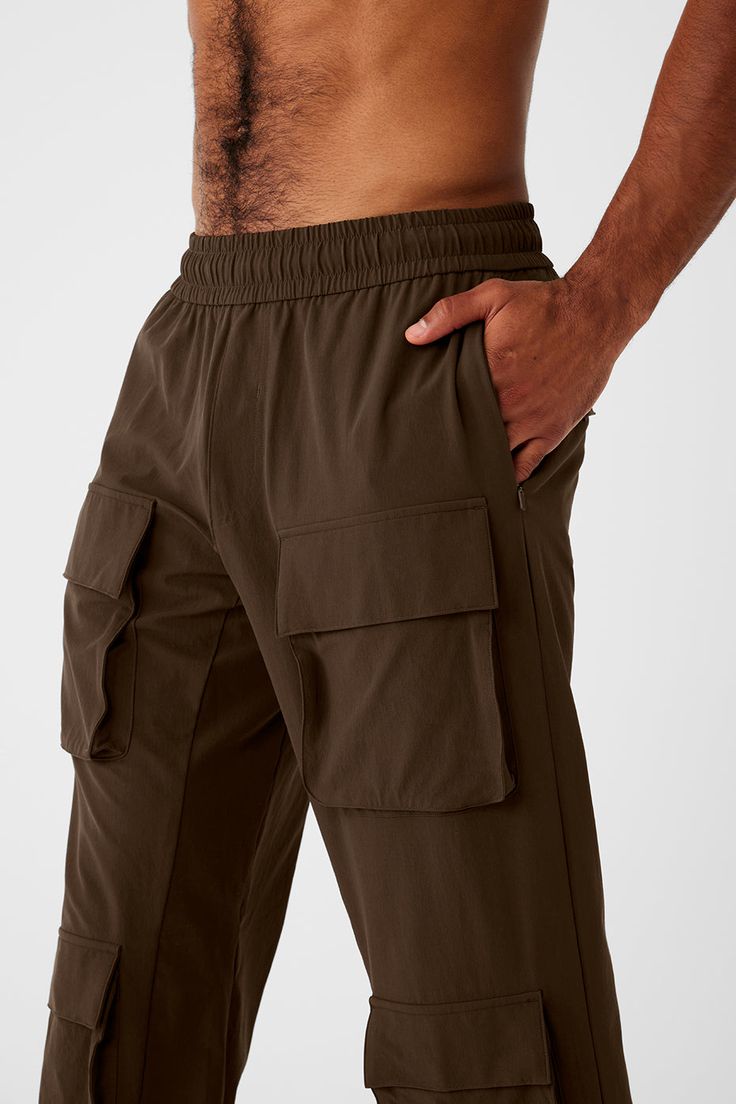 Up your game with the Cargo Venture Pant. It has awesome functionality—think all-over pockets, interior drawcords, and custom cinching at hem—plus, a water-repellent finish. From workout to wear out, it’s a winner. Front & back cargo pockets; invisible zip side pockets Interior drawcords Bungee detail at hem for custom cinching Designed & uniquely fit to flatter every size Wear-tested by our in-house team for the perfect fit Utility Style Outdoor Sweatpants With Side Pockets, Utility Style Sweatpants With Side Pockets For Outdoor, Sportswear Cargo Pants With Side Pockets For Outdoor Activities, Sportswear Cargo Pants With Side Pockets For Outdoor, Sportswear Cargo Pants For Outdoor Activities, Sporty Parachute Pants With Hip Pockets, Sporty Parachute Pants With Hip Pockets For Sports, Alo Yoga Sports Bottoms With Elastic Waistband, Functional Cargo Pants With Drawstring For Outdoor