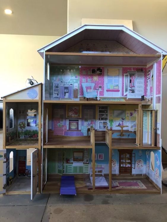 the doll house is made out of cardboard