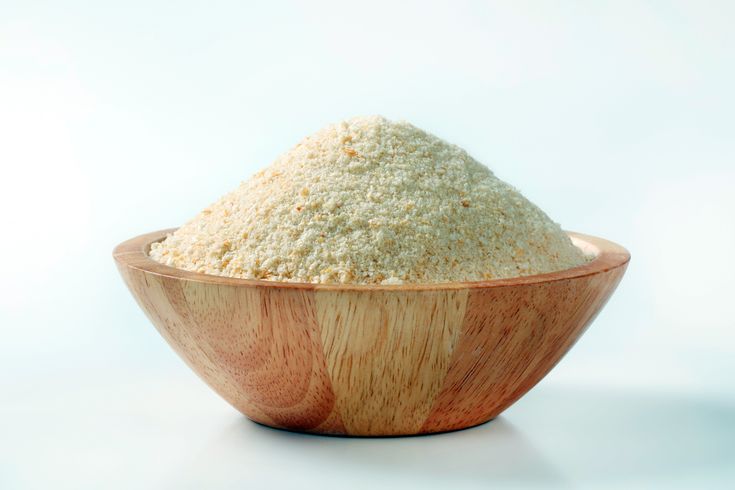 a wooden bowl filled with white powder