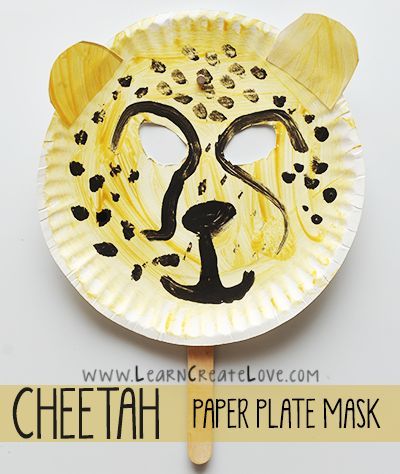 a paper plate with a leopard mask on it