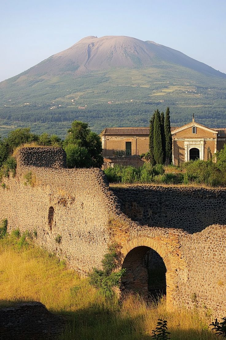 an old castle with a mountain in the background