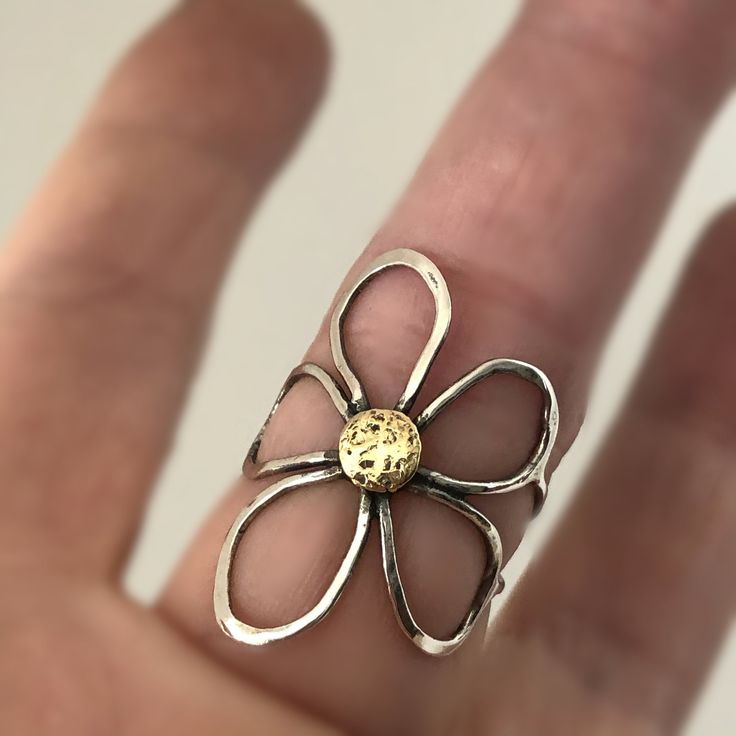 Fantastic handcrafted Sterling silver flower rings that are made to order in your size. They are handmade individually out of Sterling silver wire, oxidized for dimension and polished to high shine. These little pieces of art are relatively flat, mold around your finger and are see through, kind of like lace is. You will love this ring if you like big, handmade jewelry, that is comfortable to wear. These rings don't come from a mold. I make them individually out of wire. They are all very simila Gold Sterling Silver Flower Ring Gift, Artistic Sterling Silver Rings For Anniversary, Unique Hand Forged Sterling Silver Rings, Unique Flower Ring For Anniversary, One Of A Kind Open Ring For Anniversary, Handmade Yellow Gold Flower Promise Ring, Handmade Unique Flower Promise Ring, Hand Forged Open Ring Jewelry For Gift, Handmade Open Flower Promise Ring