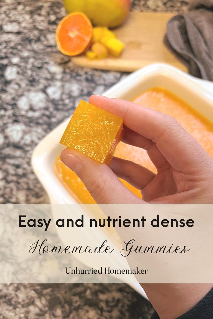 someone is holding some food in their hand with the words easy and nutritious homemade gummies