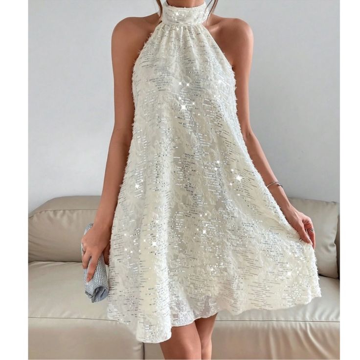 Cream Sequin Halter Mini Dress Xs S M L Xl, 100% Polyester, Ships In 7-8 Days Flowy A-line Sleeveless Party Dress, Spring Holiday A-line Dress, White Halter Neck Dress For Party Season, White Halter Neck Party Dress, White Sleeveless Midi Dress For Party Season, Spring Party Halter Dress, Flowy Fit, Flowy Halter Dress For Spring Party, White Glamorous Sleeveless Dress For Party, Glamorous White Sleeveless Dress For Party