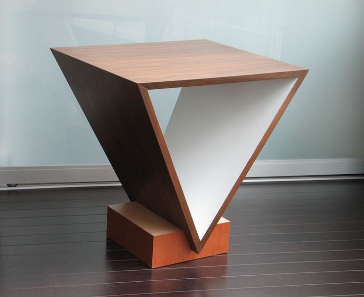 a wooden table with an unusual design on it