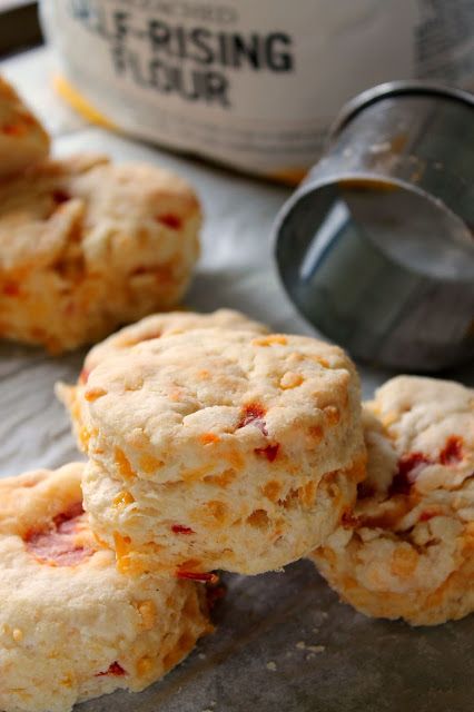 some biscuits are sitting on a table next to a bottle