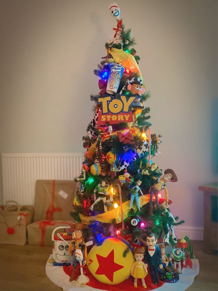 a toy story christmas tree with toys around it