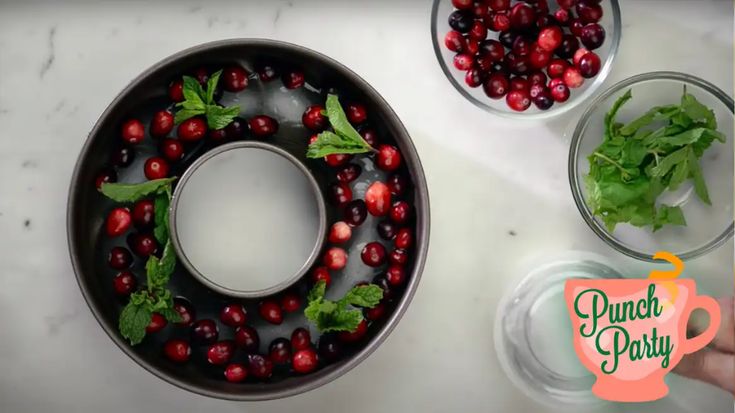 cranberries and lettuce are being put into a bundt cake for christmas