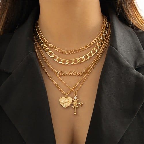 Hip-hop Gold: Cross and Heart Layered Necklace-Fashion Necklaces-StylinArts Cross Layered Necklace, Luxury Symbolic Cross Necklace, Layered Crosses, Iconic Symbols, Purpose Driven, Layered Design, Outfit Making, Gold Necklace Layered, Gold Cross