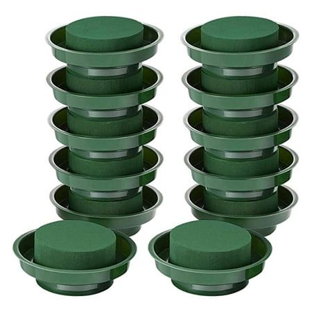 green cake pans stacked on top of each other in front of a white background