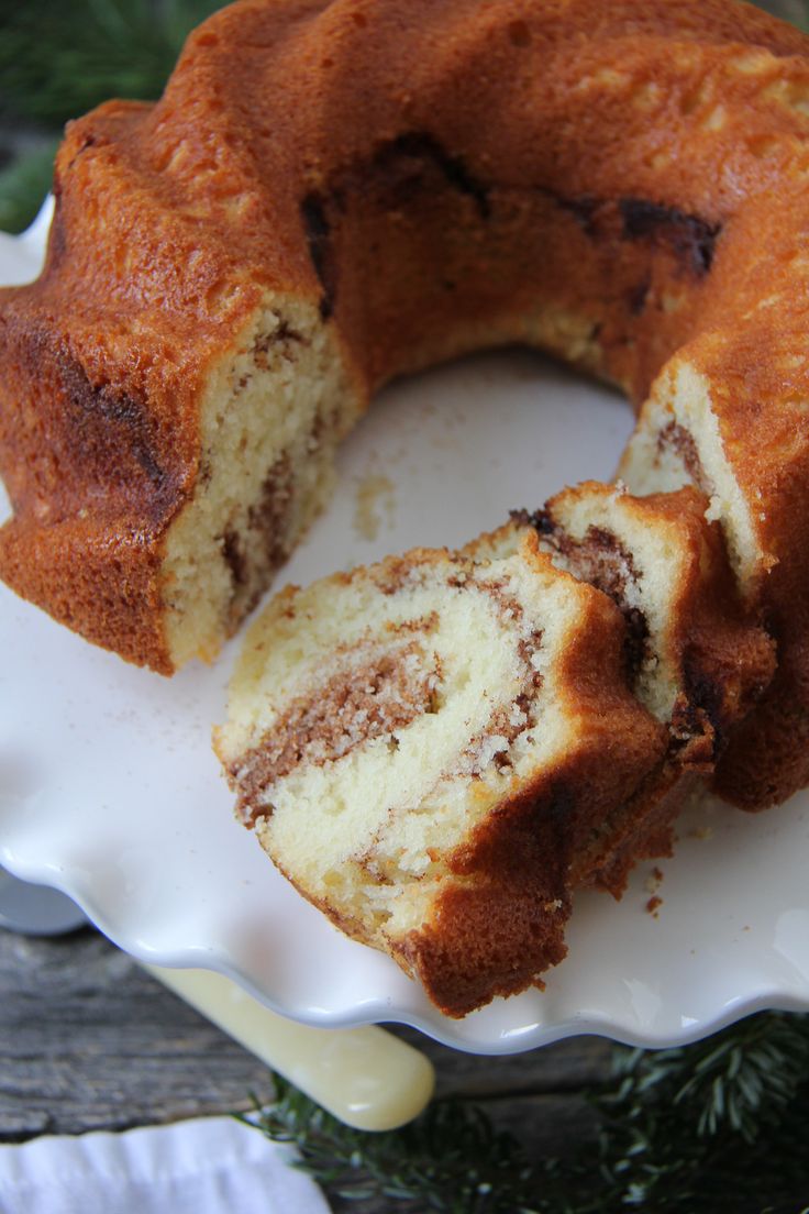 a bundt cake is cut in half on a plate