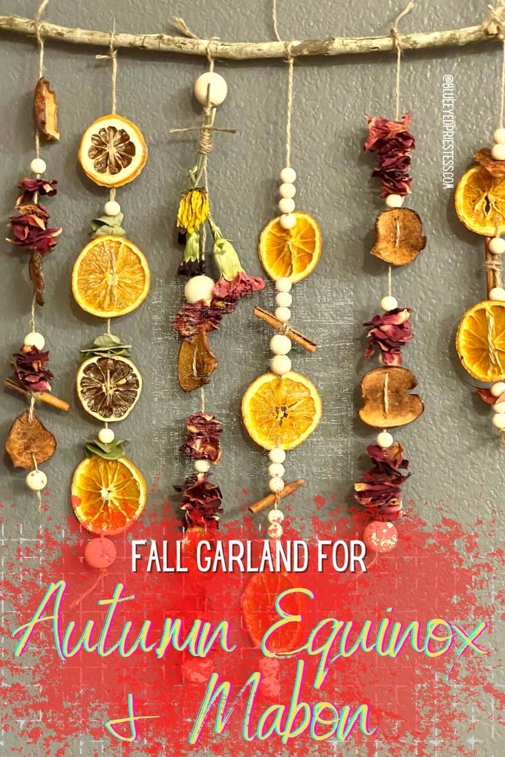 fall garland for autumn equinngs made with dried orange slices and other fruits