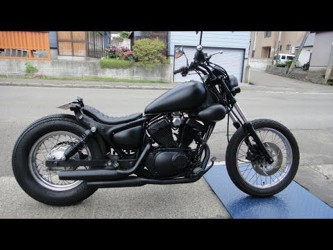 a black motorcycle is parked on the street