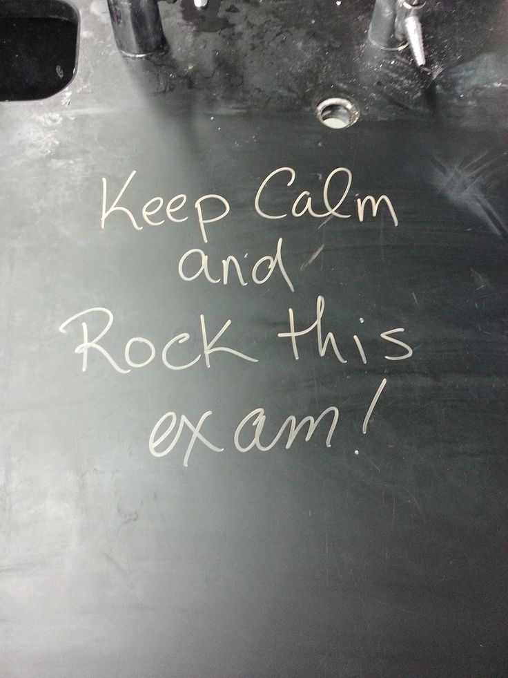 a chalkboard with writing on it that says keep calm and rock this exam,