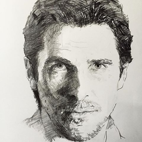 a black and white drawing of a man's face