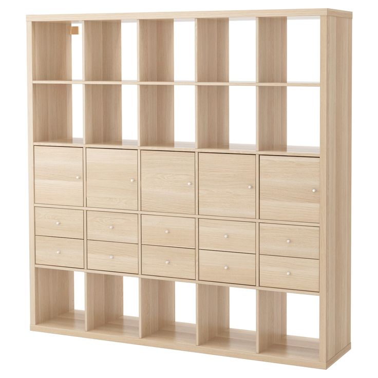 a wooden bookcase with many drawers on it