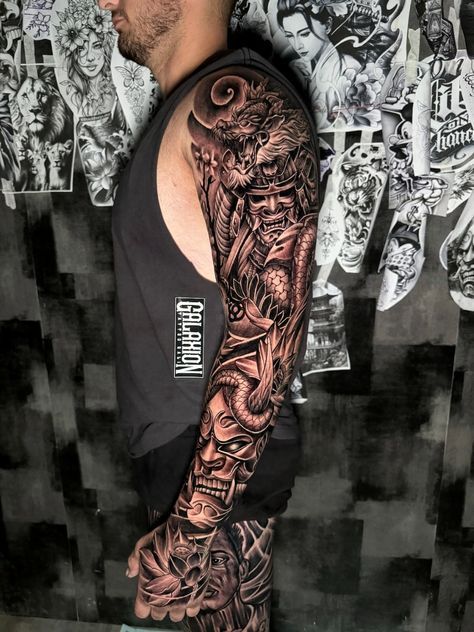 a man with a full sleeve tattoo on his arm