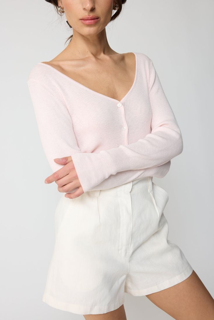 The essential spring button down v neck cardigan. Plunged neck line with ribbed cuffs and hemline. It's a soft lightweight cardigan. Contemporary Wardrobe, Neck Line, L And Light, Lightweight Cardigan, V Neck Cardigan, Wardrobe Staples, Jumpsuit Dress, Jewelry Sales, Light Pink