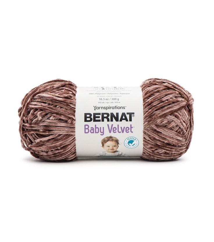 bernat baby velvet yarn ball in light brown, on a white background with the label