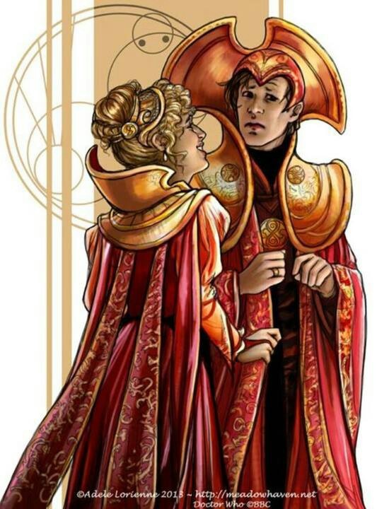 an image of a man and woman dressed in medieval clothing with gold trimmings