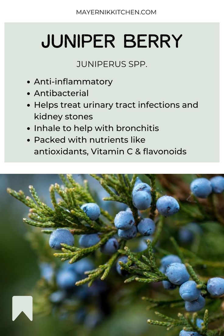 the label for juniper berry with blue berries on it