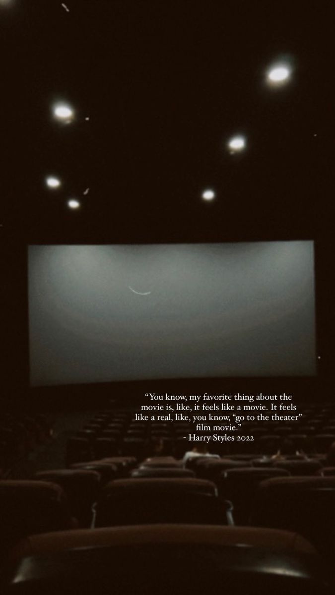 an empty theater with rows of seats and a projection screen in the center that reads, you have never seen television before