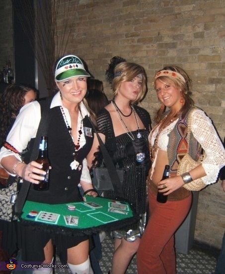 three women dressed up in costumes posing for the camera