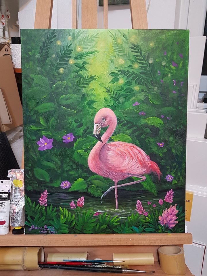 a painting of a pink flamingo standing in front of flowers and greenery on an easel