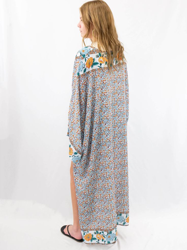 A kimono that doubles as a beach coverup is something we all need. This blue, orange, and green kimono is great for pairing with a summer or fall outfit and throwing over your favorite bathing suit. SIZE & FIT Model is 5'6" wearing ONE SIZE Multicolor Kimono For Fall Beach Cover-up, Floral Print Kimono For Beach Cover-up, Multicolor Printed Kimono For Beach Cover-up, Green Kimono, Multicolor Printed Cover-up With Kimono Sleeves, Floral Print Kimono Beach Cover-up, Beach Kimono, Bathing Suits, Fitness Models