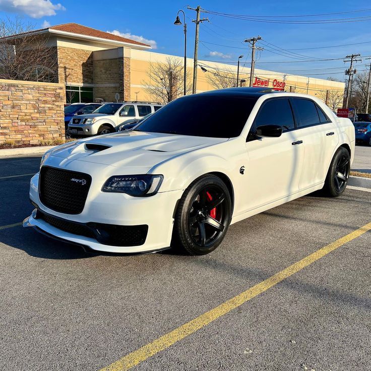 a white car parked in a parking lot