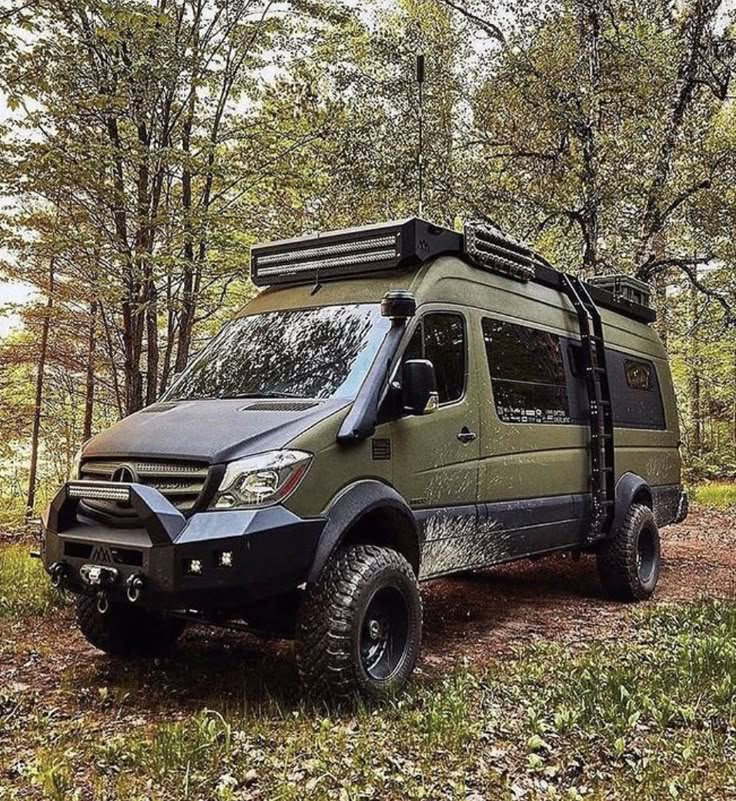 an off road vehicle parked in the woods