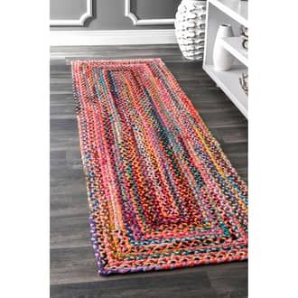 a multicolored rug on the floor in a room