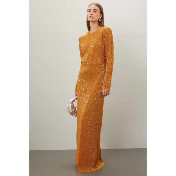 Gold jersey (50% Polyester 50% Metallic). Lining (100% Polyester). A-line. Long sleeves. Crewneck. Back zipper closure. 61" from shoulder to hemline. Imported. Gold Gown, Stine Goya, Rent The Runway, Closet Designs, A Line, Long Sleeves, Crew Neck, Zipper, Long Sleeve