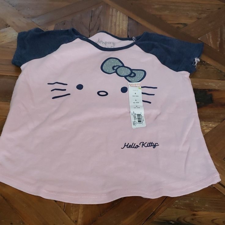 Jumping Bean Hello Kitty T Shirt Size 6 Pink Short Sleeve T-shirt For Playtime, Playful Hello Kitty T-shirt For Spring, Hello Kitty Short Sleeve Tops For Summer, Playful Hello Kitty Tops For Spring, Spring Hello Kitty Playful Tops, Hello Kitty Cotton Crew Neck Top, Cotton Hello Kitty Fun Tops, Fun Cotton Tops With Hello Kitty, Fun Hello Kitty Short Sleeve Tops