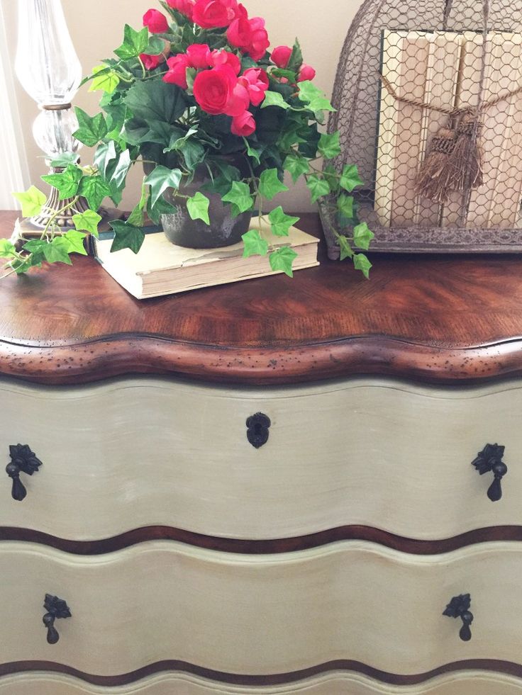 a flower pot sitting on top of a dresser