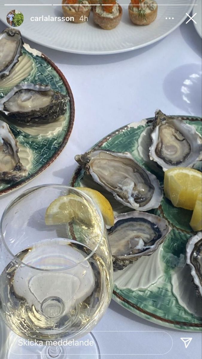 oysters on the half shell with lemon and wine